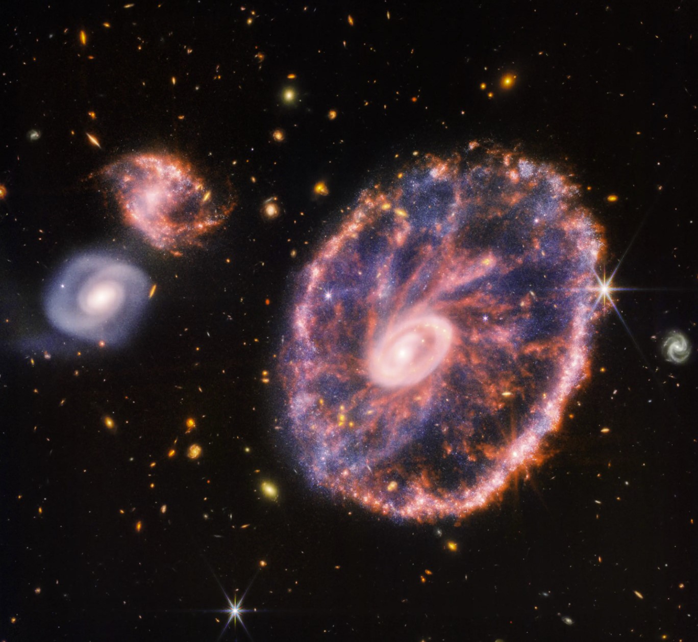 Oszałamiające nowe zdjęcia Galaktyki Koło Wozu wykonane przez Kosmiczny Teleskop Jamesa Webba.